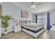 Serene main bedroom featuring a comfortable bed, beach themed accents, and natural light at 758 Orchid Dr, Davenport, FL 33897