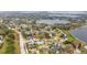 Aerial view showcases neighborhood, lakes, and mature landscaping at 8128 Hook Cir, Orlando, FL 32836