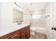 Modern bathroom with a new vanity, undermount sink, tile shower and a large mirror at 8128 Hook Cir, Orlando, FL 32836