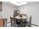 Cozy breakfast nook features a round table, microwave, and white walls at 8128 Hook Cir, Orlando, FL 32836