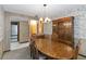 Formal dining room with wood table and chairs with a large wooden china cabinet at 8128 Hook Cir, Orlando, FL 32836