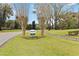 Bay Lakes community sign surrounded by colorful flowers and mature trees at 8128 Hook Cir, Orlando, FL 32836