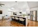 Contemporary kitchen with island and bar seating, stainless steel appliances, and a modern design at 8128 Hook Cir, Orlando, FL 32836