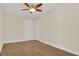 Clean bedroom featuring wood floors, white trim, and ceiling fan at 8691 Contoura Dr, Orlando, FL 32810