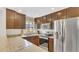 Well-lit kitchen features stainless steel appliances and granite countertops at 8691 Contoura Dr, Orlando, FL 32810