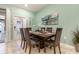 Dining room featuring seating for six and an abstract art piece hanging above the table at 8912 Adriatico Ln, Kissimmee, FL 34747