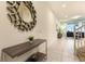 Bright hallway featuring modern decor and tiled floors, leading to the living area at 8912 Adriatico Ln, Kissimmee, FL 34747