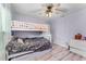 Bedroom featuring modern bunkbeds, stylish decor, and wood flooring at 1006 Gotwalt Dr, Oviedo, FL 32765