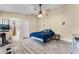 Bedroom featuring laminate flooring, a ceiling fan, and neutral paint, offering a calming space at 1006 Gotwalt Dr, Oviedo, FL 32765