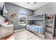 Bedroom featuring a window and bunkbeds at 1006 Gotwalt Dr, Oviedo, FL 32765