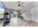 Bonus Room with sliding door access to the backyard and exercise equipment at 1006 Gotwalt Dr, Oviedo, FL 32765