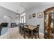 The dining room is adjacent to the living room and features a table with four chairs at 1006 Gotwalt Dr, Oviedo, FL 32765