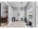 Hallway/entry space with decor, light flooring, and access to dining room at 1006 Gotwalt Dr, Oviedo, FL 32765