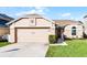 Charming single-story home with a well-maintained lawn, a two-car garage, and neutral exterior paint at 1006 Gotwalt Dr, Oviedo, FL 32765