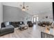 Spacious living room with wood floors, comfortable seating, a ceiling fan, and lots of natural light at 1006 Gotwalt Dr, Oviedo, FL 32765