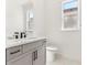 Modern bathroom with a double vanity, white countertops, and brushed black accents at 1098 Victoria Hills S Dr, Deland, FL 32724