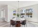 Dining room boasts views of a lake, a modern chandelier, and lots of natural light at 1098 Victoria Hills S Dr, Deland, FL 32724