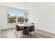 Dining room displays large window with a picturesque view and modern chandelier at 1098 Victoria Hills S Dr, Deland, FL 32724