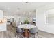 Open-concept dining area showcases a modern chandelier and connects to the kitchen at 1098 Victoria Hills S Dr, Deland, FL 32724