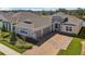 Charming home featuring a stone facade, brick driveway, and a two-car garage at 1098 Victoria Hills S Dr, Deland, FL 32724