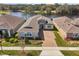 Aerial view of house with brick driveway, stone facade, and manicured lawn at 1098 Victoria Hills S Dr, Deland, FL 32724