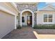 Charming single-story home featuring a two car garage and stone accents at 1098 Victoria Hills S Dr, Deland, FL 32724