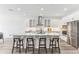 Modern kitchen boasts stainless steel appliances, white cabinets, and a large island at 1098 Victoria Hills S Dr, Deland, FL 32724