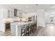Bright kitchen with a large island, stainless steel appliances, and a wine fridge at 1098 Victoria Hills S Dr, Deland, FL 32724
