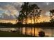 A stunning lake view at sunset at 1098 Victoria Hills S Dr, Deland, FL 32724