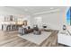 Open-concept living area with a modern kitchen, stainless steel appliances, and wood flooring at 1098 Victoria Hills S Dr, Deland, FL 32724