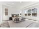 Bright main bedroom with large windows showcasing scenic views of the surrounding nature at 1098 Victoria Hills S Dr, Deland, FL 32724