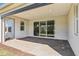 This covered patio features brick pavers and recessed lighting at 1098 Victoria Hills S Dr, Deland, FL 32724