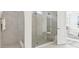 Modern walk-in shower featuring glass doors and a built-in bench, adjacent to the main bedroom at 1098 Victoria Hills S Dr, Deland, FL 32724