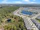 An aerial view of homes and the surrounding landscape, showcasing the lakes and trees at 1121 Avery Meadows Way, Deland, FL 32724