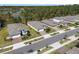 This aerial view of shows homes with mature landscaping and beautiful streets at 1121 Avery Meadows Way, Deland, FL 32724
