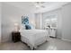 This bedroom has tile floors, a ceiling fan, and a window for plenty of natural light at 1121 Avery Meadows Way, Deland, FL 32724