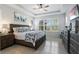 Tranquil bedroom with tray ceilings, neutral tones and large windows at 1121 Avery Meadows Way, Deland, FL 32724