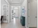 Bright foyer featuring tile flooring, a decorative table, and an open view into the adjoining living spaces at 1121 Avery Meadows Way, Deland, FL 32724