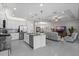 Open concept kitchen with stainless steel appliances, an island and an adjacent living area at 1121 Avery Meadows Way, Deland, FL 32724