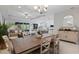 Open concept living/dining showcases stylish furnishings, natural light, and seamless flow to kitchen at 1121 Avery Meadows Way, Deland, FL 32724