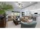 Open-concept living room, with access to the kitchen and outdoor patio at 1121 Avery Meadows Way, Deland, FL 32724