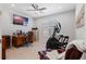 Bright office featuring a ceiling fan, tile flooring, desk, cabinets, and an elliptical machine at 1121 Avery Meadows Way, Deland, FL 32724