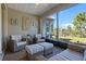 Inviting covered patio with brick flooring, ceiling fan, and comfortable seating for outdoor enjoyment at 1121 Avery Meadows Way, Deland, FL 32724