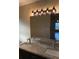Bathroom featuring double sinks and a granite countertop at 117 Stewart Lake Loop, Groveland, FL 34736