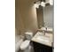 Bathroom featuring granite countertops, modern lighting, and a tub with a shower at 117 Stewart Lake Loop, Groveland, FL 34736
