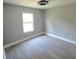 Comfortable bedroom offering natural light and laminate wood flooring at 1200 Jarecki Ave, Holly Hill, FL 32117