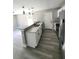 Bright kitchen featuring granite countertops, stainless steel appliances and laminate floors at 1200 Jarecki Ave, Holly Hill, FL 32117