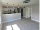 Inviting living room showcasing a modern open concept with an eat-in kitchen at 1200 Jarecki Ave, Holly Hill, FL 32117