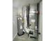 Efficiently organized utility closet featuring water heater and modern HVAC system at 1200 Jarecki Ave, Holly Hill, FL 32117