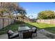 Cozy backyard patio with comfortable seating, perfect for outdoor relaxation and entertaining at 1207 Rich Moor Cir, Orlando, FL 32807